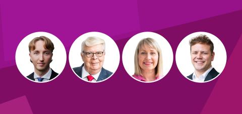 Fuksianpunaisella pohjalla on neljä valkopohjaista palloa, joissa on pormestarin, valtuuston puheenjohtajan ja kahden apulaispormestarin kasvot.