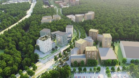 The picture shows a wooded area with clusters of apartment buildings.