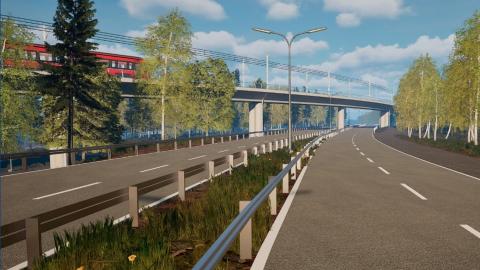 Kuvassa viheralueta sekä silta jossa ratikka kulkee.