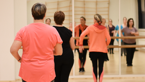 Three people in the dance hall.