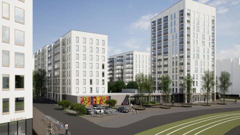 Kuvassa katu ja tori, raitiotie ja valkoisia kerrostaloja.