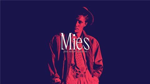 Miehen kuva keskellä mustaa taustaa, päällä valkoisella lukee MIES.