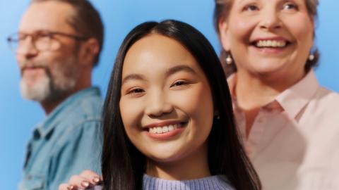 The photo shows three people of different ages.