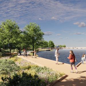 Kuvassa vasemmalla taloja, verhreä ja vihreä kesäinen laituripolku keskellä ja laitureja ja järvinäkymää oikealla.