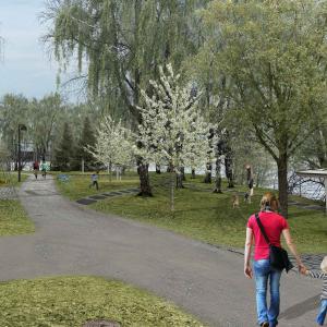 Vanhempi ja lapsi Koukkuniemenpuiston rantareitillä.