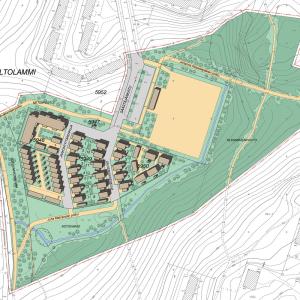 Kuvassa vihreällä alueella ruskealla asuintalojen hahmoja ja kenttä keltaisella.