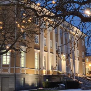A large yellow building in dim winter lighting.