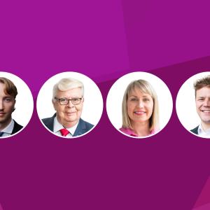 Fuksianpunaisella pohjalla on neljä valkopohjaista palloa, joissa on pormestarin, valtuuston puheenjohtajan ja kahden apulaispormestarin kasvot.