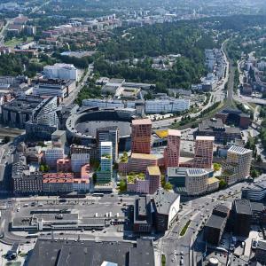 Kuvassa uusia rakennuksia havainnekuvina ilmakuvassa.