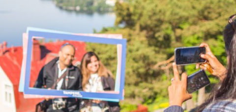 People taking pictures and posing in Pyynikki.