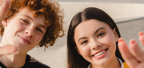young people waving into to the camera