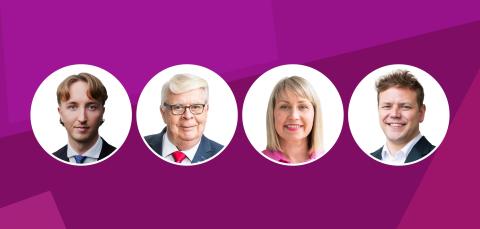 Fuksianpunaisella pohjalla on neljä valkopohjaista palloa, joissa on pormestarin, valtuuston puheenjohtajan ja kahden apulaispormestarin kasvot.