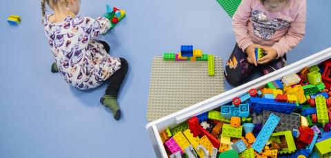 The children are playing with Lego.