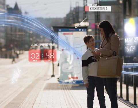 A boy and a woman holding a mobile phone in the street. Embedded in the image are various graphic elements related to digital development.