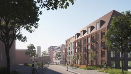 Havainnekuvassa Hiedanrannan Tehdaskartanonkatua ja uusia taloja, vesitorni näkyy.