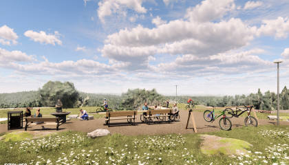 Havainnekuva Hervannanmäen huipulta, jossa näkyy nuotiopaikka, pöytiä ja tuoleja.