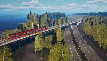 Raitiotiesilta ja ratikka ylittävät kadun metsäisessä ympäristössä.