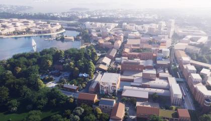 Havainnekuvassa näkyy etualalla Hiedanrannan tehdas sekä suunniteltuja rakennuksia sen ympärillä kauniina kesäpäivänä.