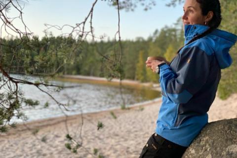 Tampere Talent Ambassador Esin Guldogan on a shore of a lake