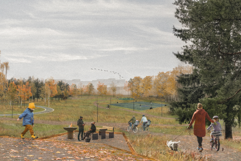 Ihmisiä puistoalueella, jossa näkyy puita ja nurmialuetta syksyllä.