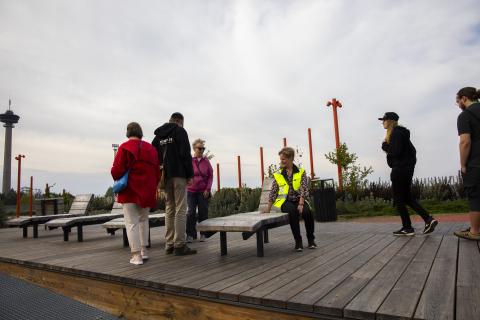 A group of citizens visiting Näsi Park Bridge in a cloudy weather.