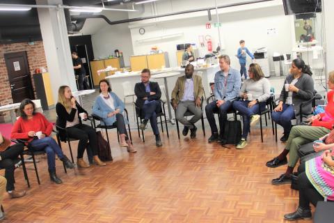 Group of Tampere Ambassadors sitting on chairs in a circle.